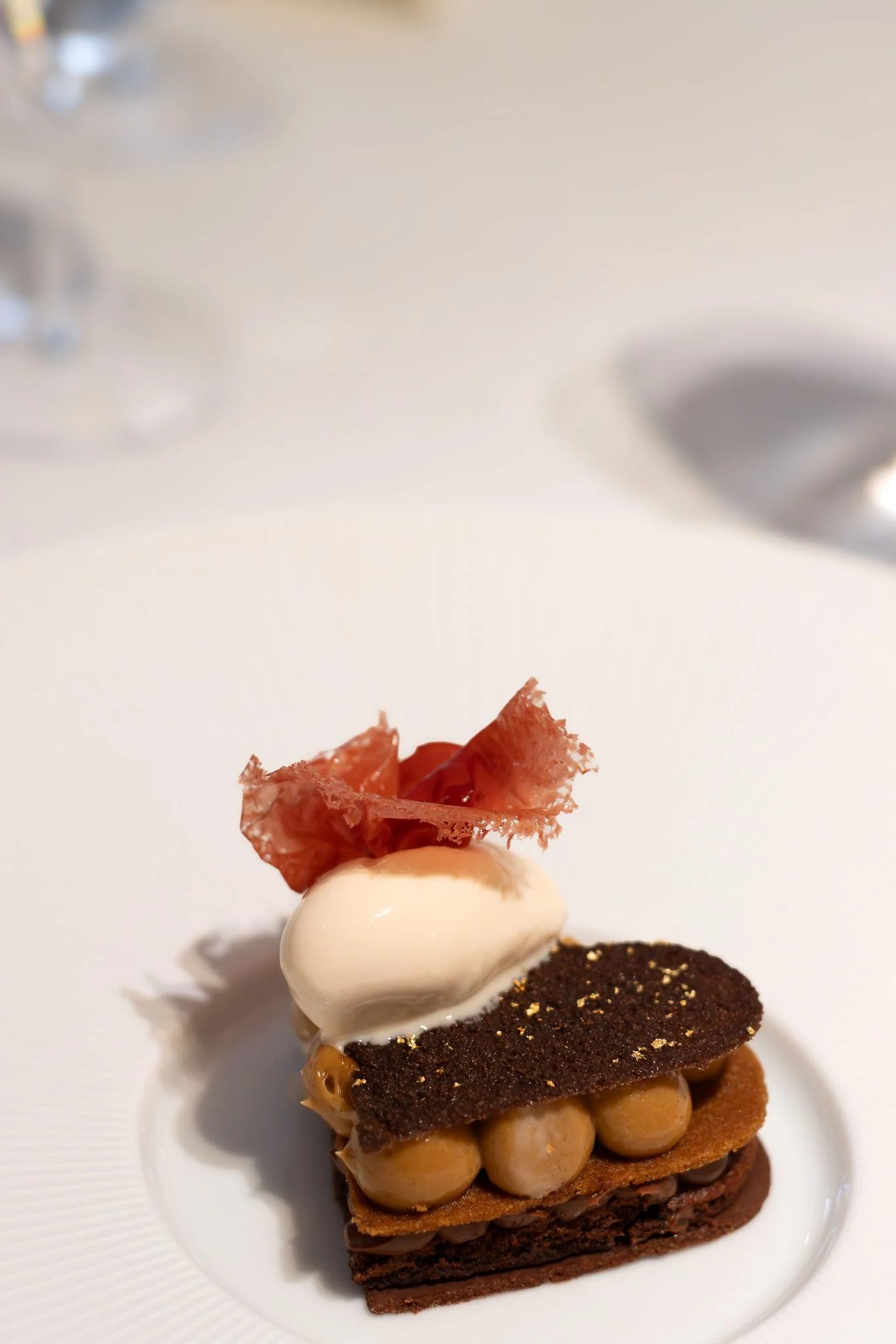 A multi-layered dessert with various textures and flavors. Petrus.